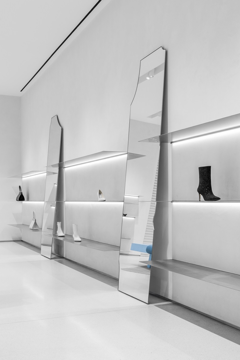 da bureau scatters white stone blocks into footwear concept store in moscow
