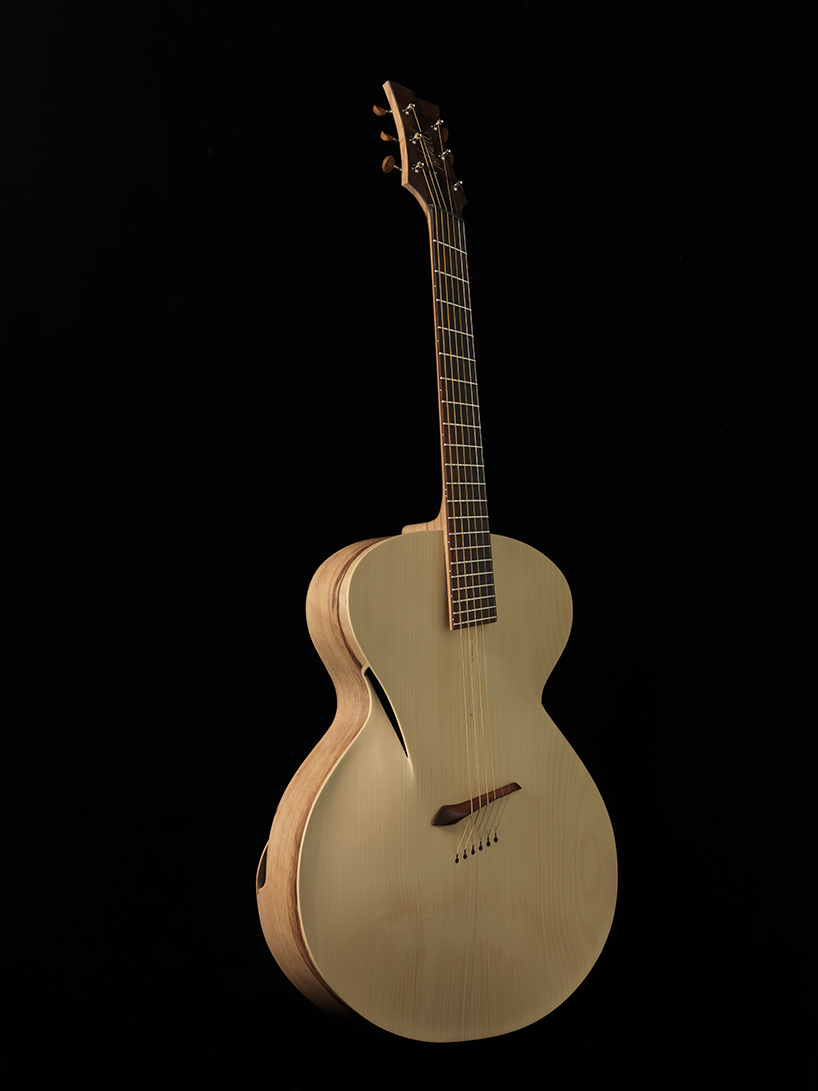 maxwell custom carefully crafts the 'infinitum' acoustic guitar