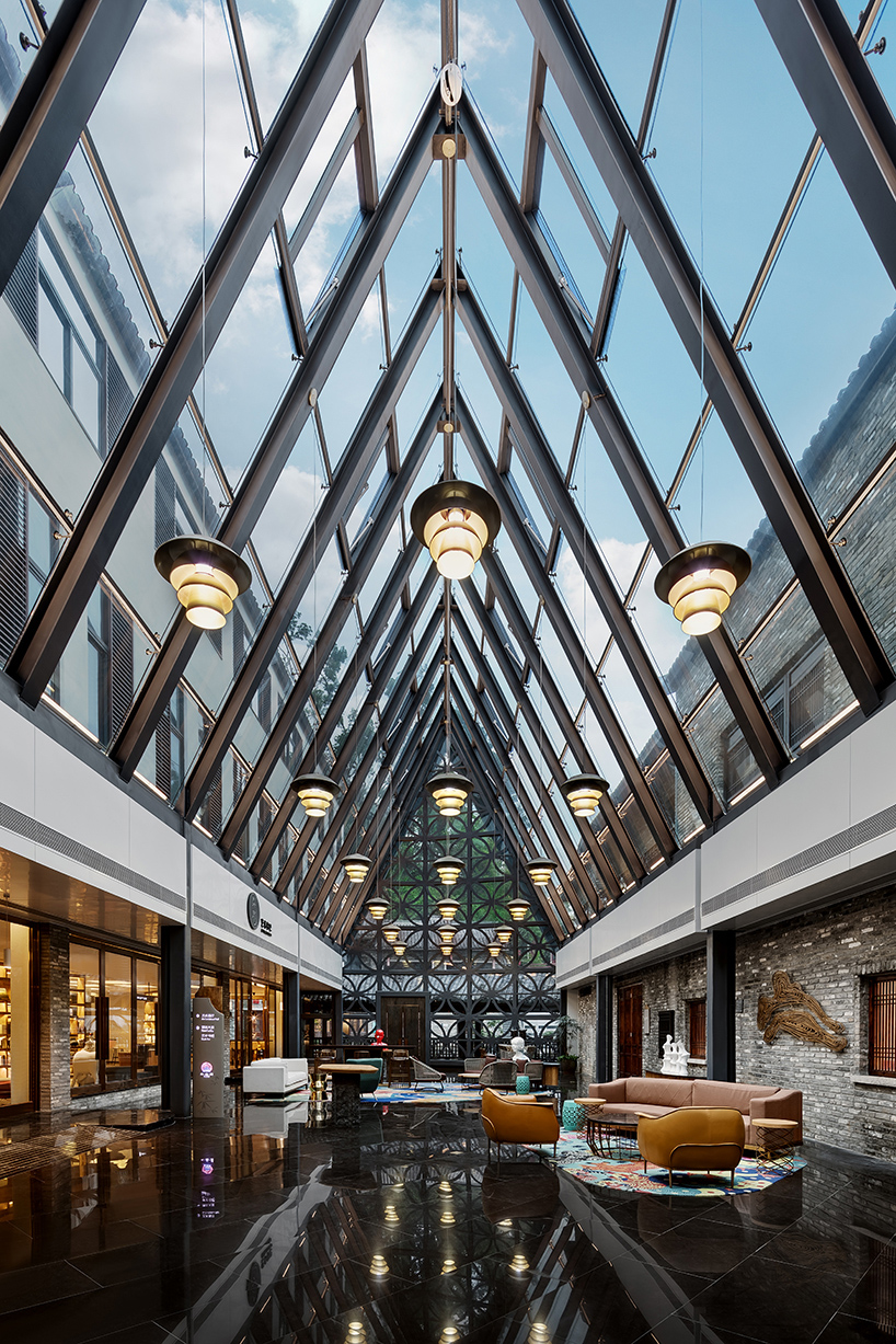 pleasanthouse inserts two glass volumes into nanxianglou art hotel in shenzhen designboom