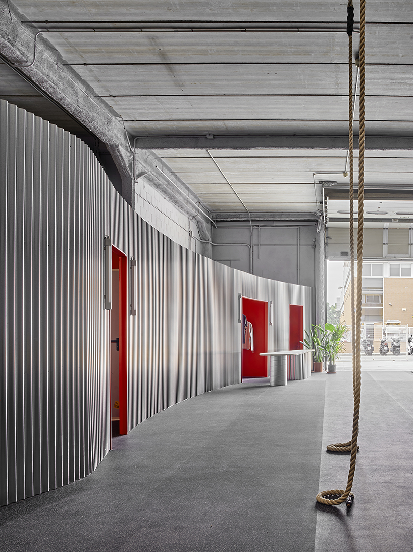 auba studio's sleek steel intervention turns former warehouse into fitness center in spain