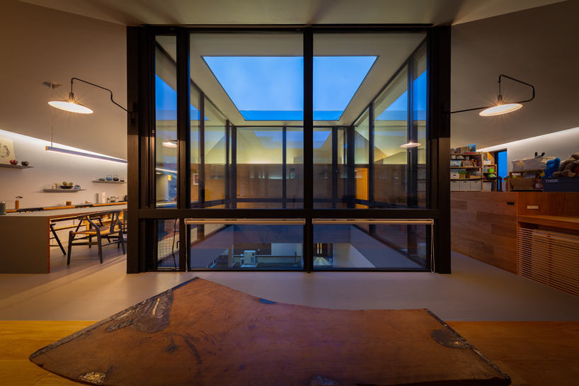 square skylight cutout organizes house's interior layout in japan