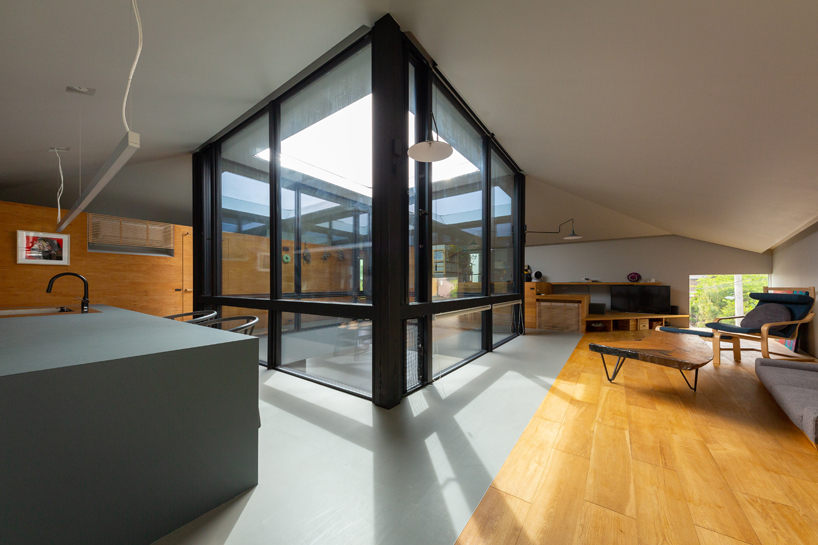 square skylight cutout organizes house's interior layout in japan