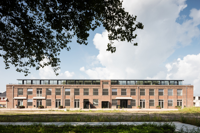wenink holtkamp's factory conversion in the netherlands preserves industrial character designboom