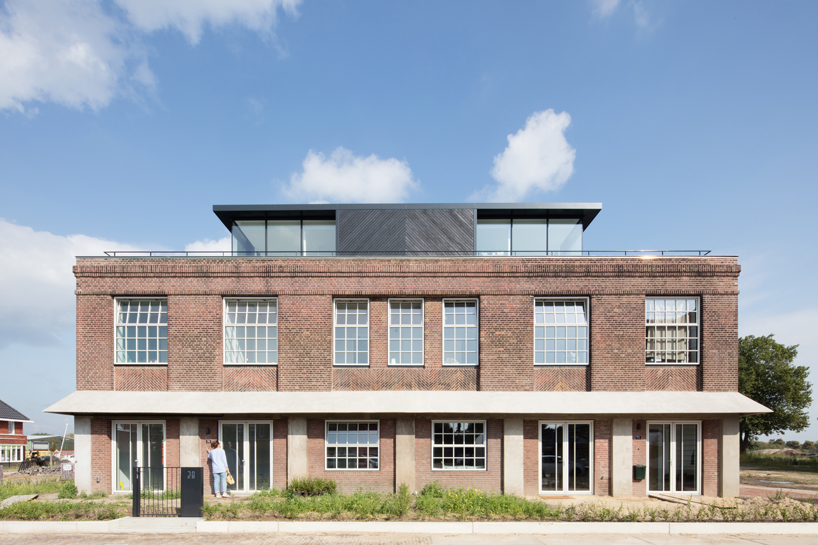 wenink holtkamp's factory conversion in the netherlands preserves industrial character designboom