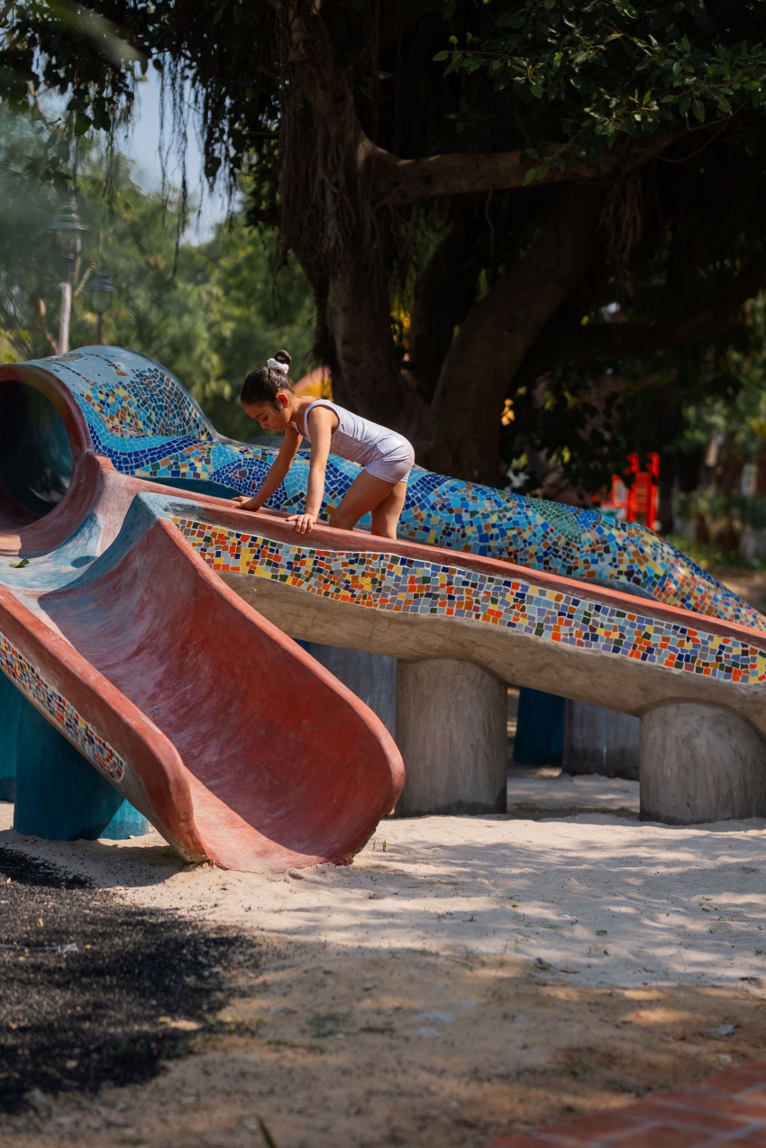 reclaimed materials sculpt textured children’s play structures in india public park