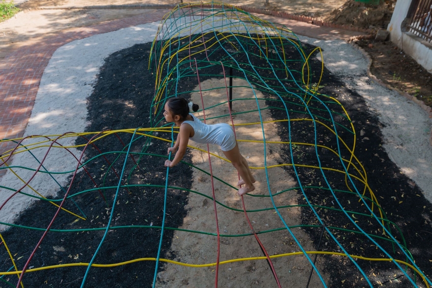 reclaimed materials sculpt textured children’s play structures in india public park
