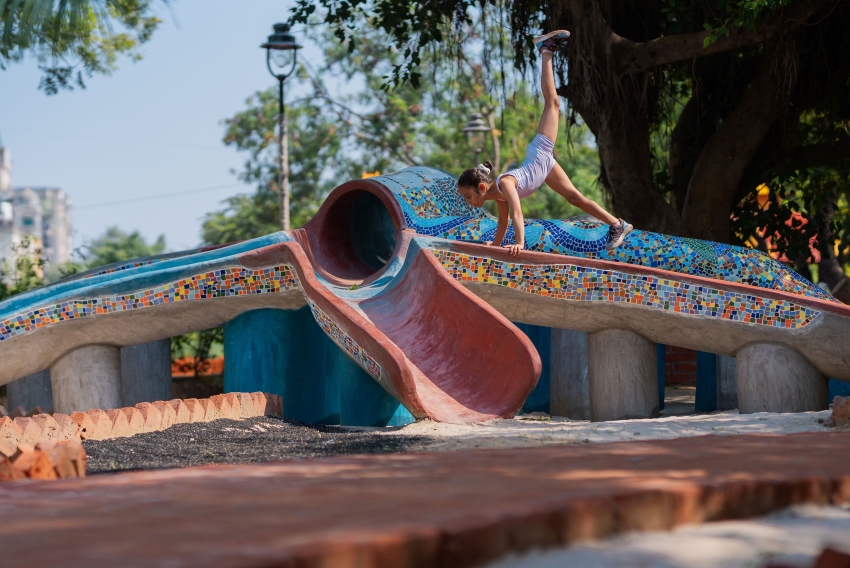 reclaimed materials sculpt textured children’s play structures in india public park