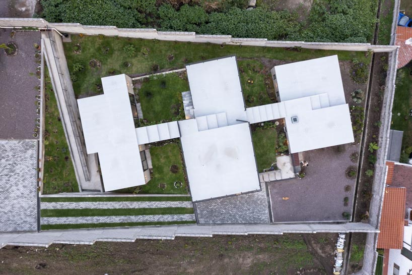 three interconnected staggered volumes shape house on slope in ecuador 