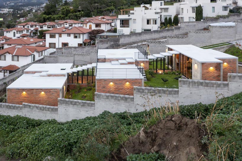 three interconnected staggered volumes shape house on slope in ecuador 