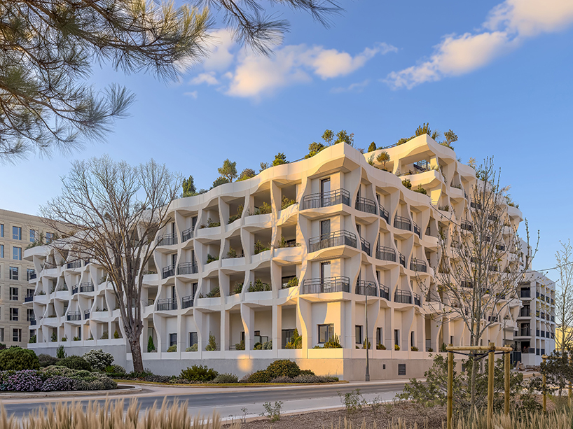 curved shell-like facades enfold montpellier residential units by vincent callebaut - 7