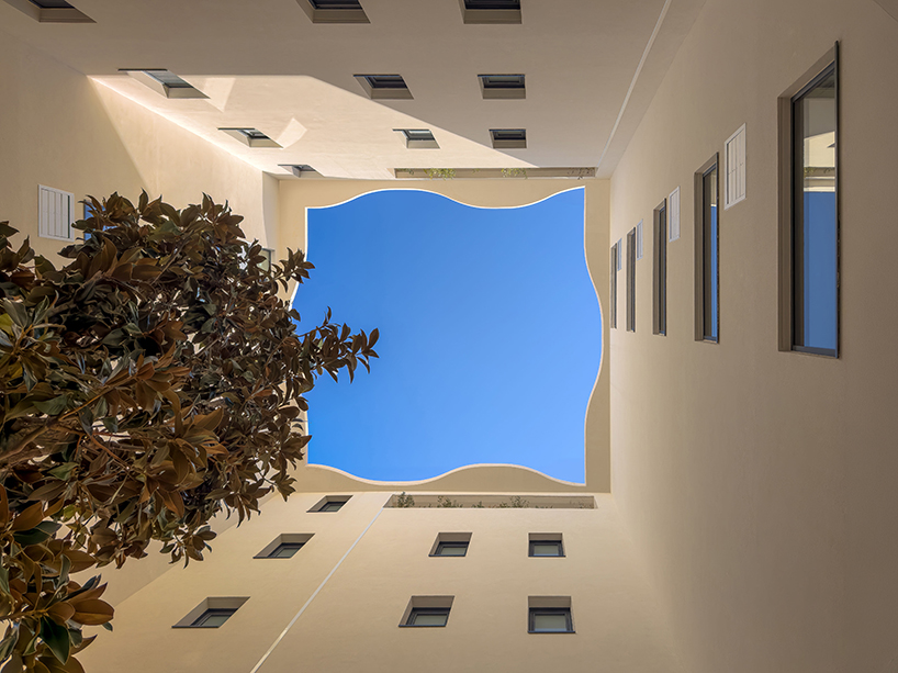 curved shell-like facades enfold montpellier residential units by vincent callebaut - 5