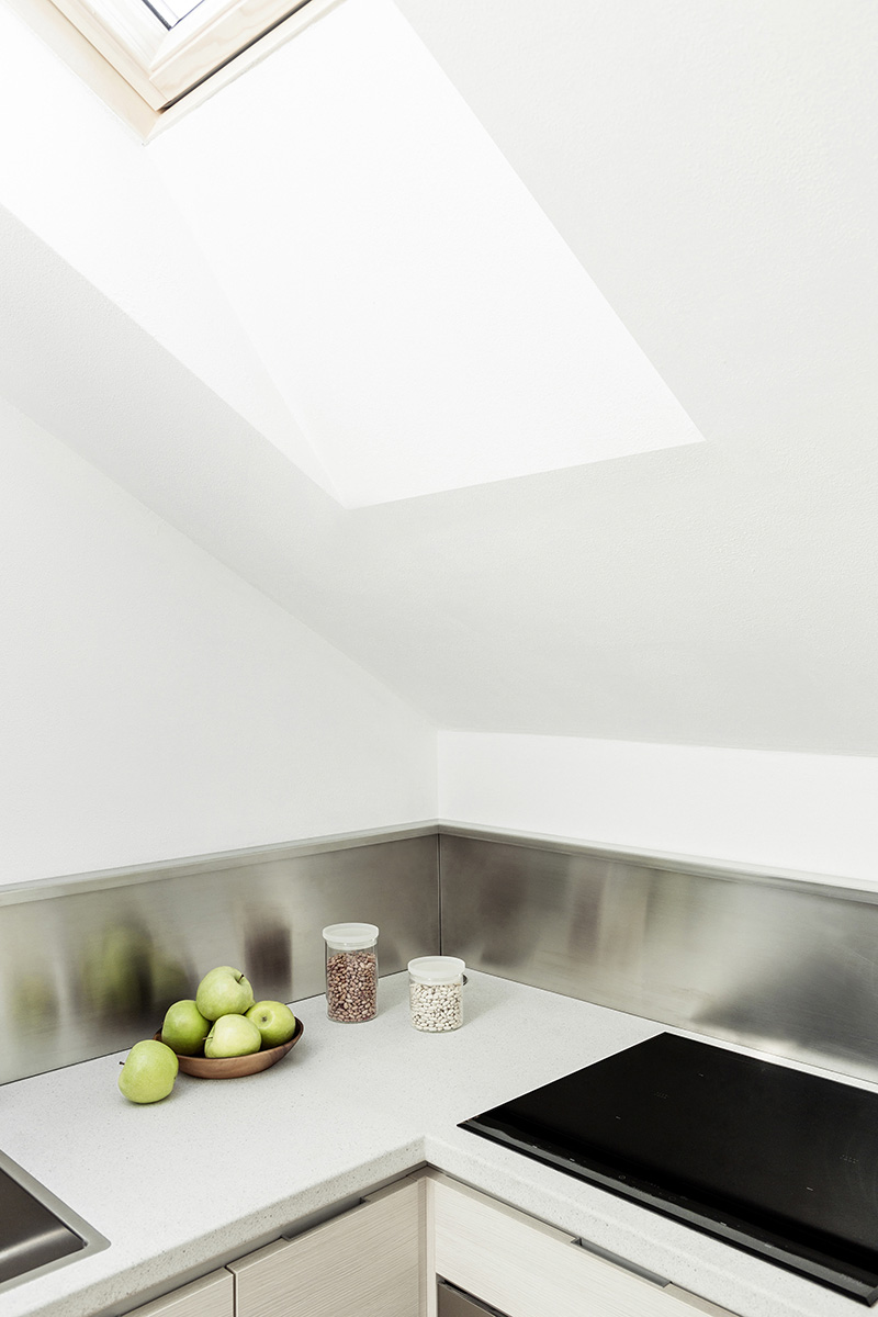 untitled architecture brings natural light into a compact apartment in milan designboom