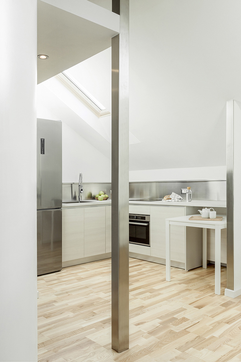 untitled architecture brings natural light into a compact apartment in milan designboom