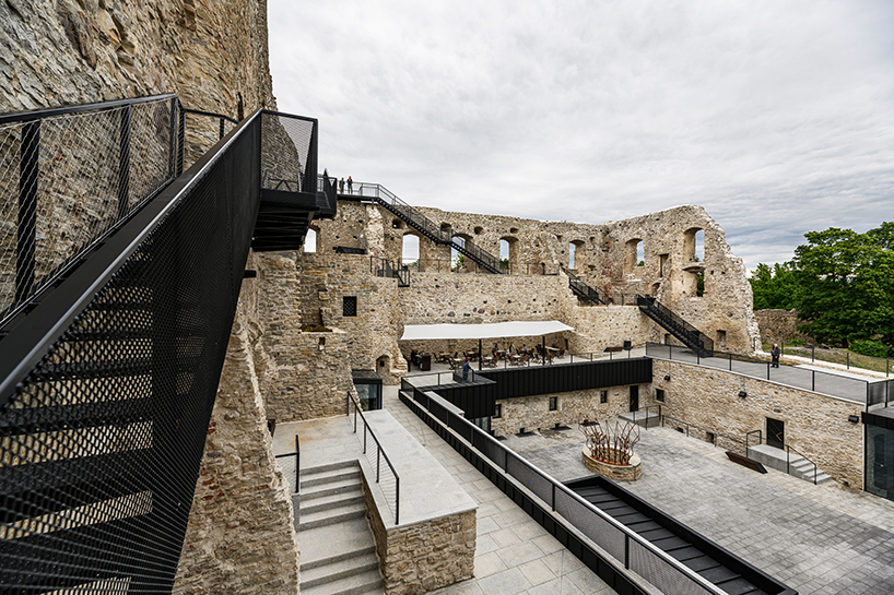 kaos architects converts 13th-century estonian castle into modern