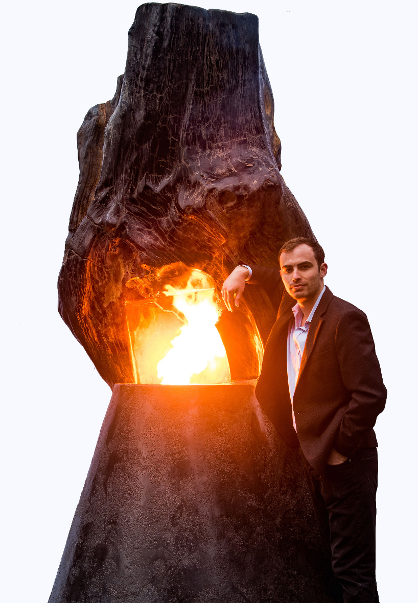 'ascendance' is a petrified wood fireplace designed by metaplace industries designboom