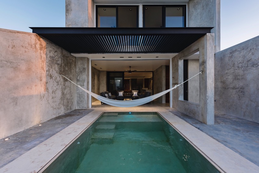 cabrera arqs builds chuburná house in polished concrete along mexico's yucatan coast