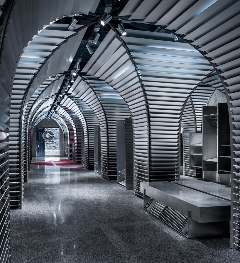 dongqi architects creates metal clad columns for concept store renovation in shanghai designboom