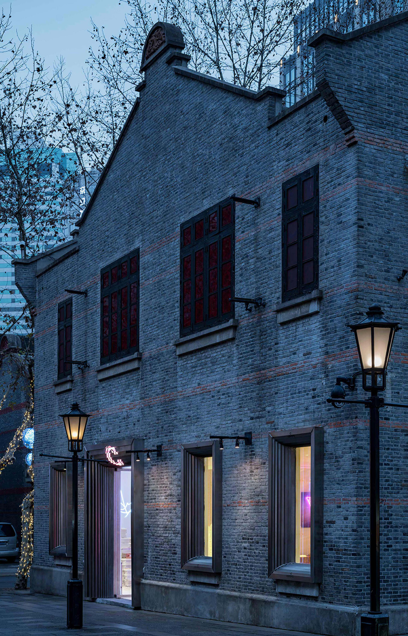 dongqi architects creates metal clad columns for concept store renovation in shanghai designboom