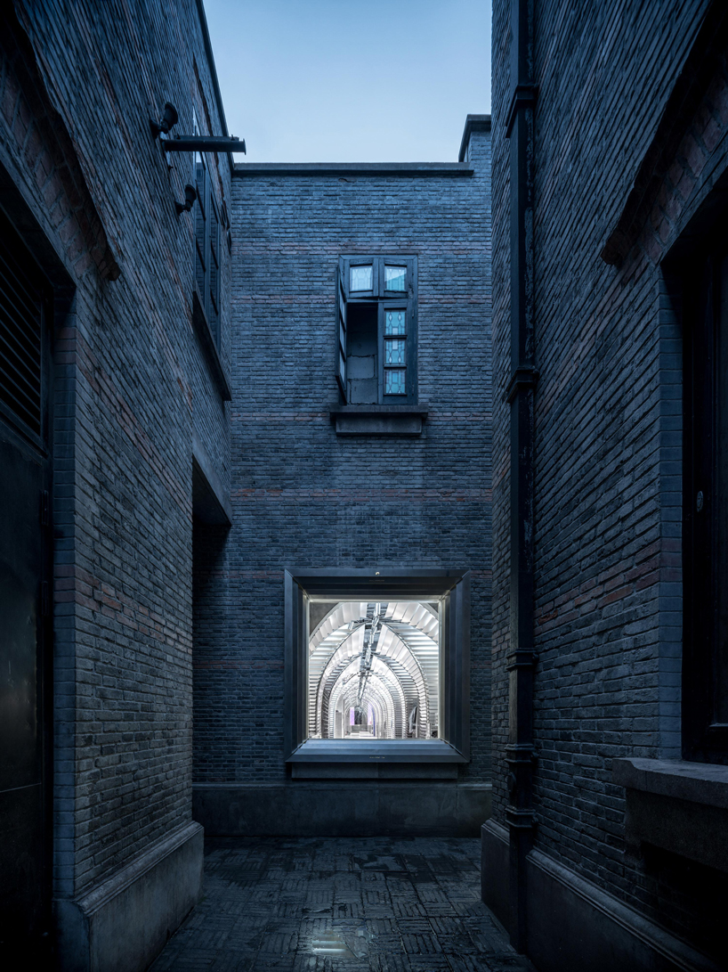 dongqi architects creates metal clad columns for concept store renovation in shanghai designboom