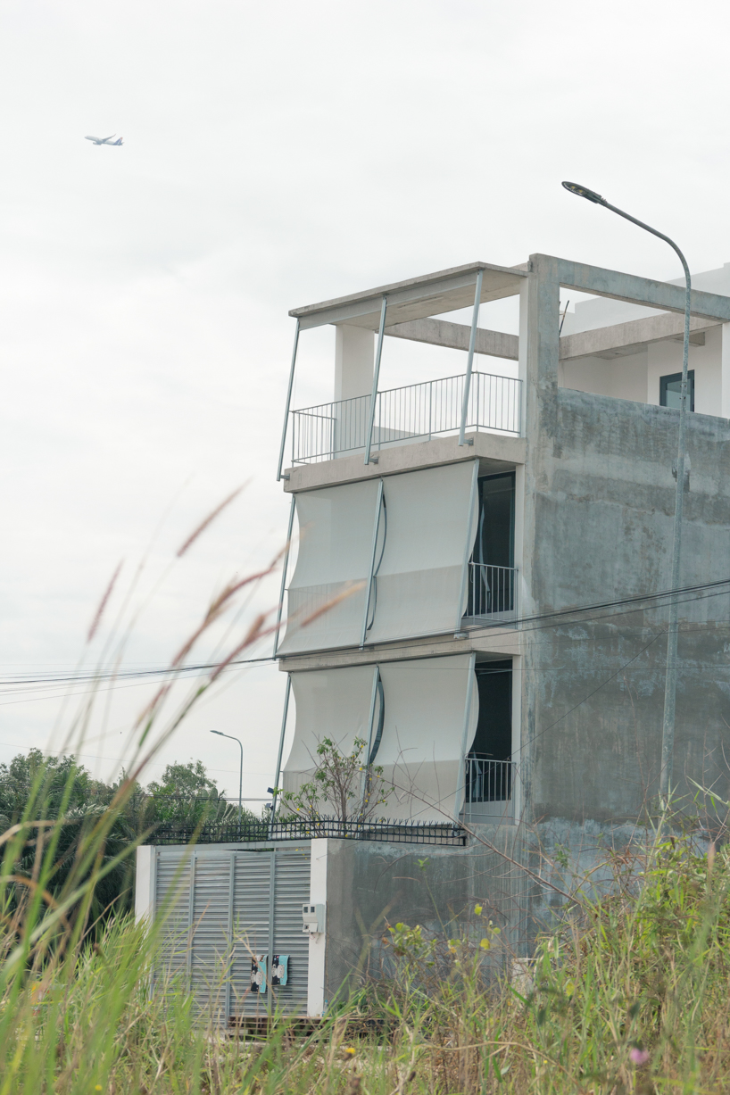 semi-transparent blinds cover the narrow front of 2713 house in vietnam