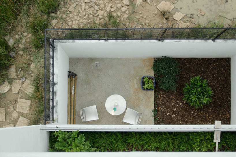 semi-transparent blinds cover the narrow front of 2713 house in vietnam