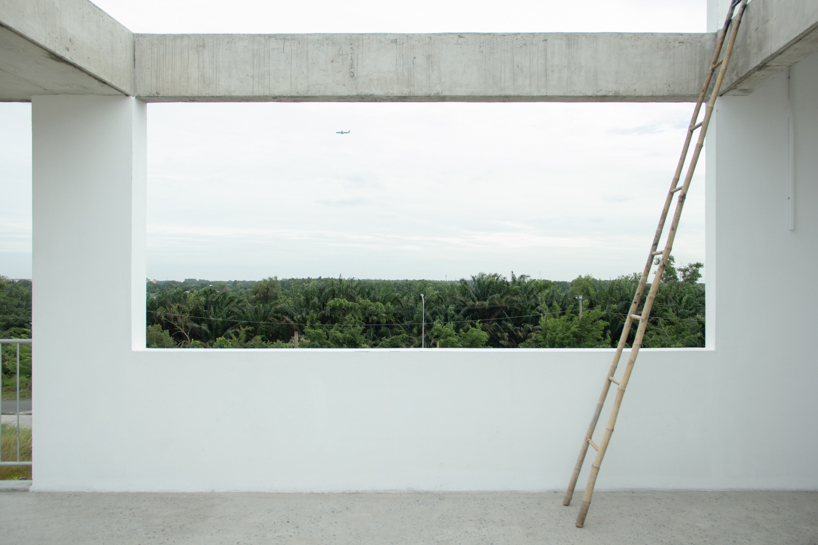semi-transparent blinds cover the narrow front of 2713 house in vietnam