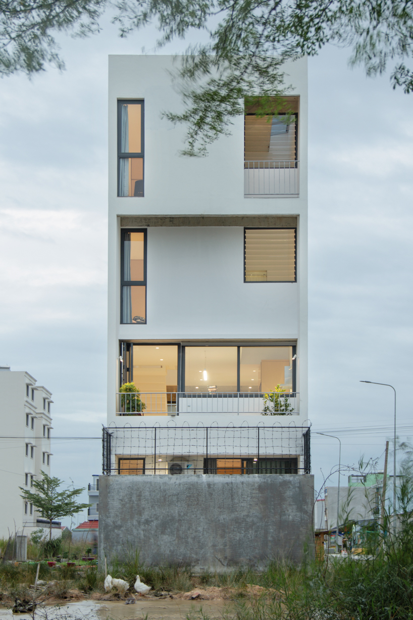 semi-transparent blinds cover the narrow front of 2713 house in vietnam