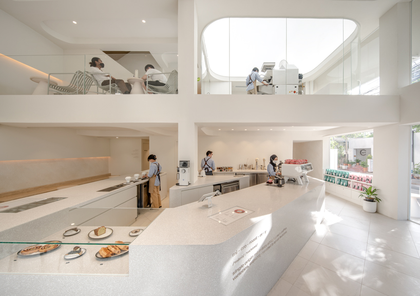 warm neutrals and soft curves shape PAGA microroastery in bangkok designboom