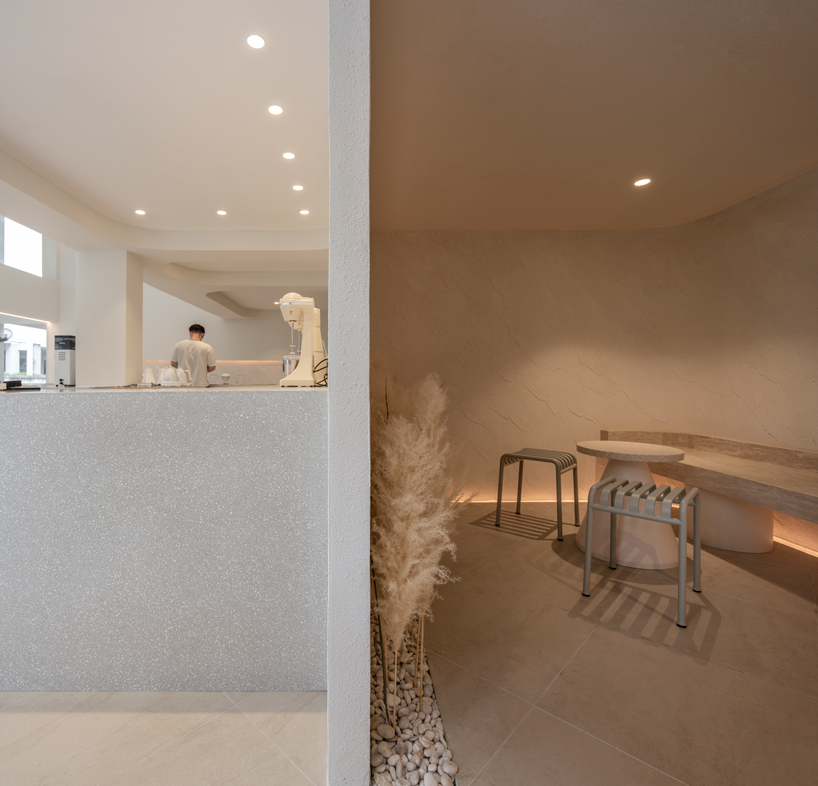 warm neutrals and soft curves shape PAGA microroastery in bangkok designboom