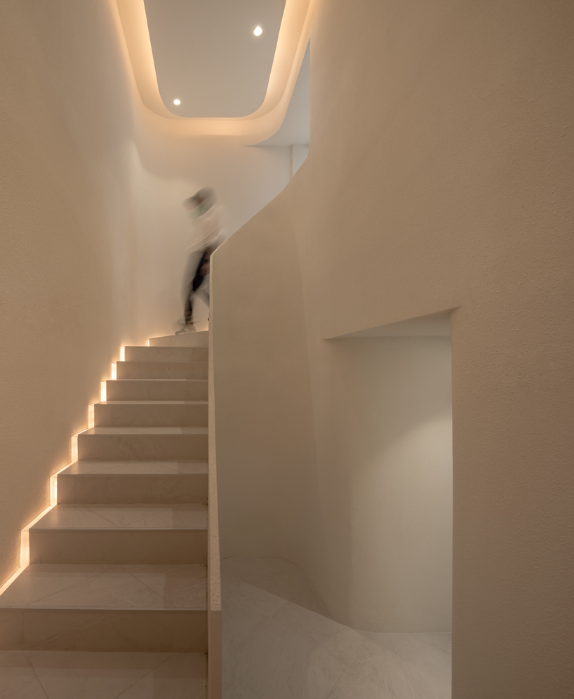 warm neutrals and soft curves shape PAGA microroastery in bangkok designboom