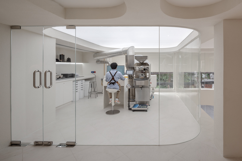 warm neutrals and soft curves shape PAGA microroastery in bangkok designboom