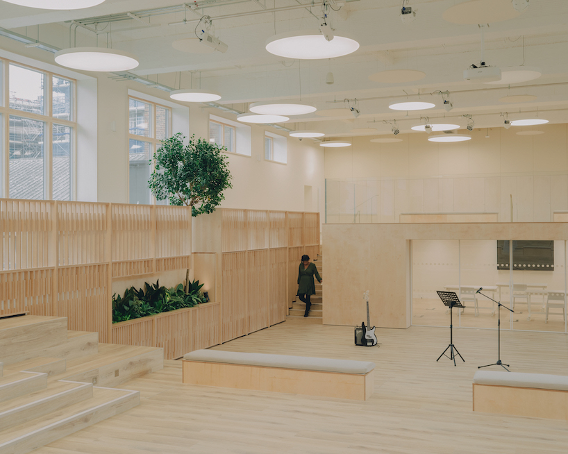 former swimming pool converts into multi-use timber education space for london college