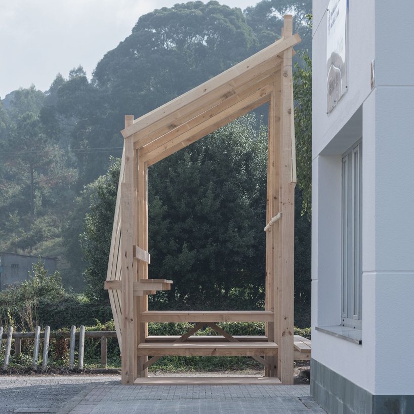 erazo pugliese and cesuga cover modular wooden installation's frame with translucent fabrics