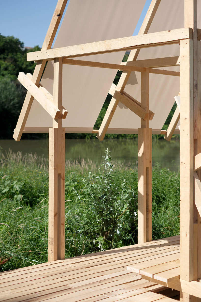 wood and textile installation reconnects river and city during concentrico 2025 11