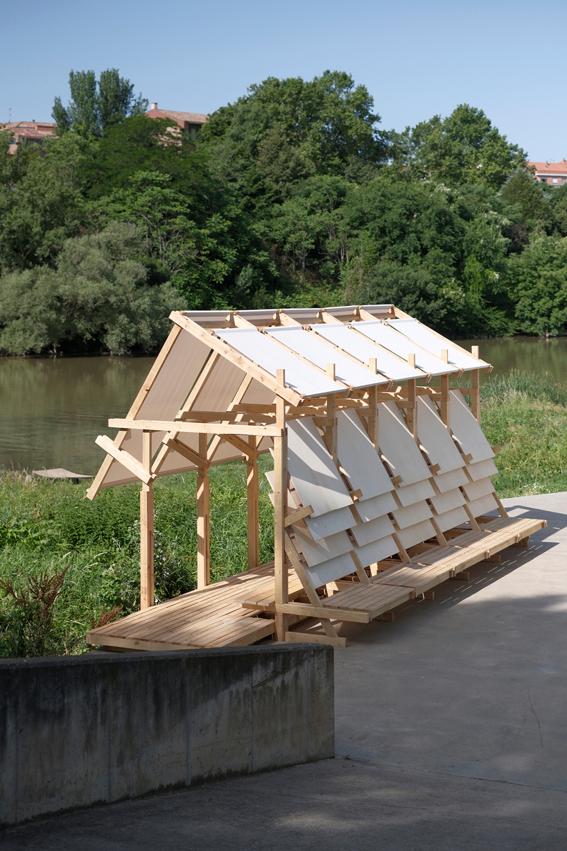 wood and textile installation reconnects river and city during concentrico 2025 6