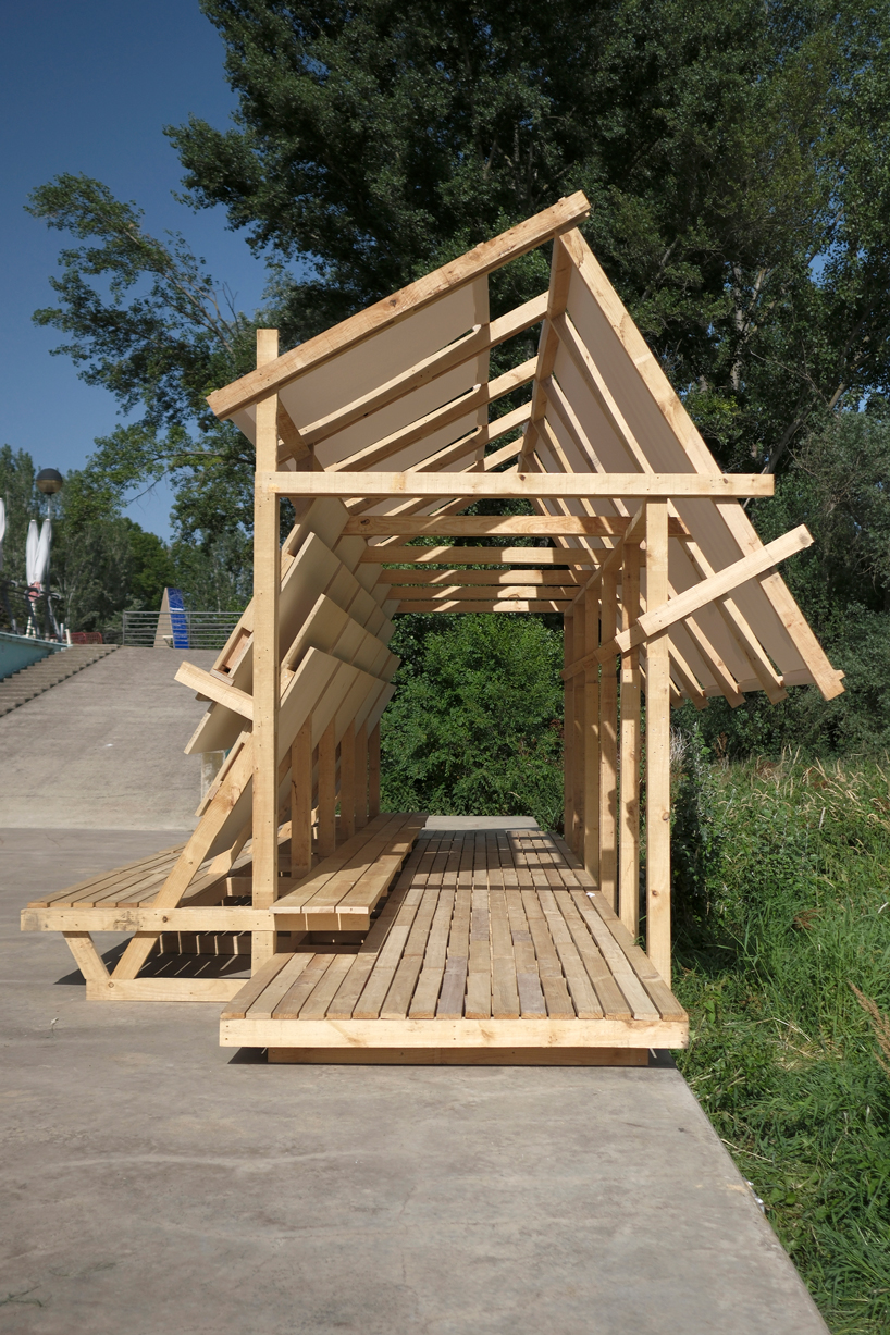 wood and textile installation reconnects river and city during concentrico 2025 9