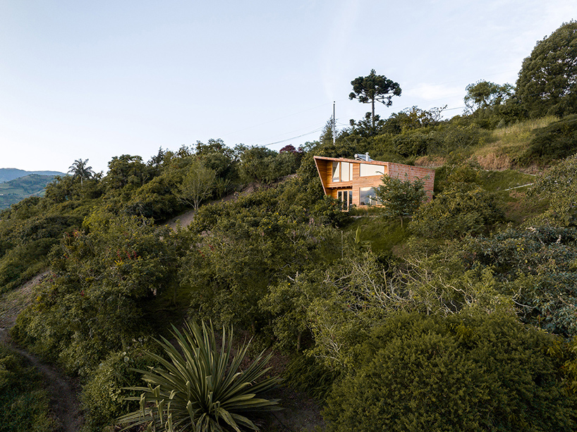 uniform skin of bricks coats casa perucho's facades in ecuador