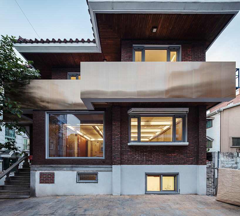 stpmj adds a metal staircase to the front of salon guui in seoul, korea designboom