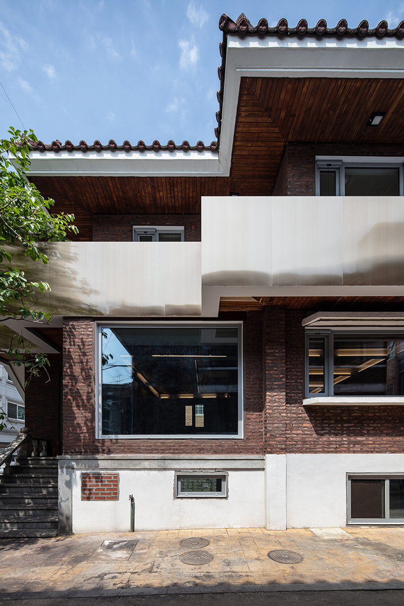 stpmj adds a metal staircase to the front of salon guui in seoul, korea designboom