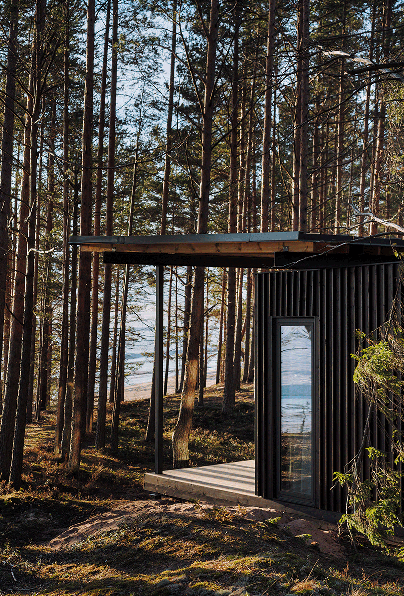 prefab cabin hotel by rhizome settles isolated within karelian landscape, in russia