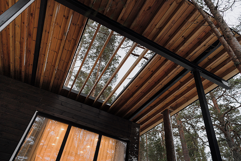 prefab cabin hotel by rhizome settles isolated within karelian landscape, in russia