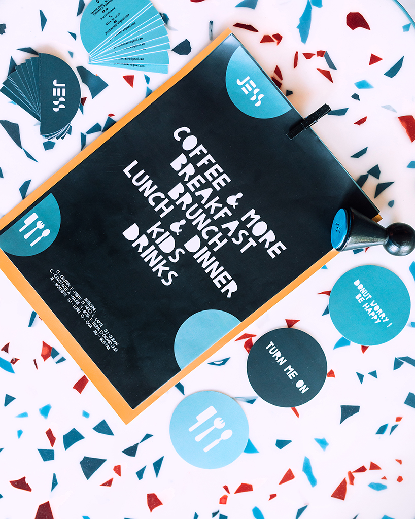 biancoebianca combines soft shapes with colorful terrazo in dramatic romanian restaurant