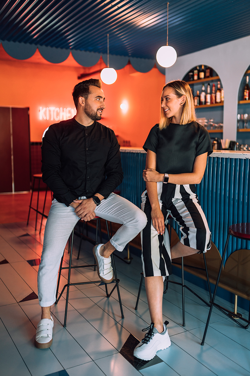 biancoebianca combines soft shapes with colorful terrazo in dramatic romanian restaurant