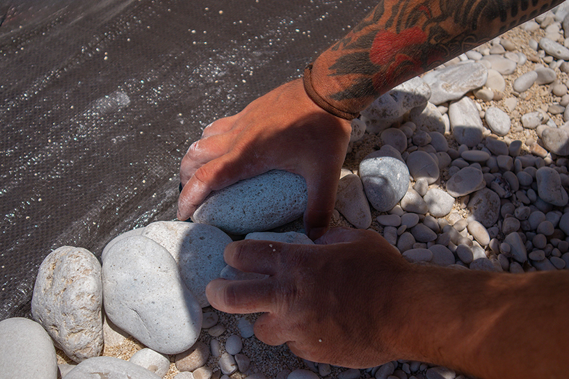 the krank turns greek beach into land art scene of ancient hunters and modern extraction - 7