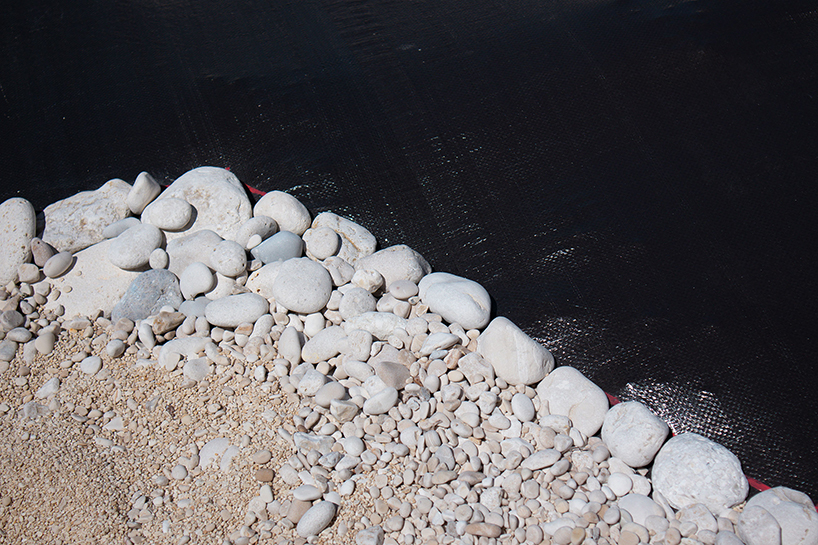 the krank turns greek beach into land art scene of ancient hunters and modern extraction - 6