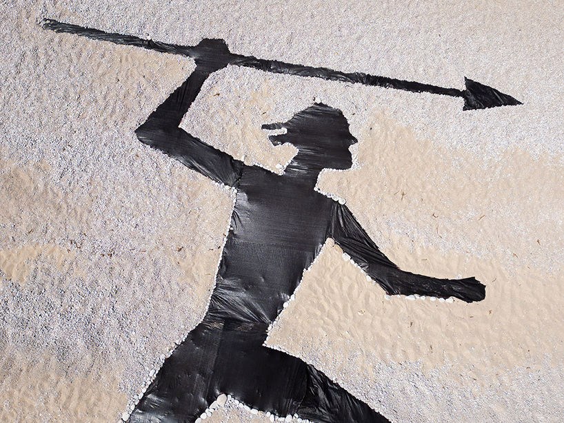 the krank turns greek beach into land art scene of ancient hunters and modern extraction - 5