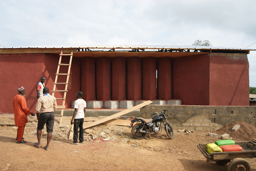 hypothesis atelier sculpts library walls in ivory coast create habitable