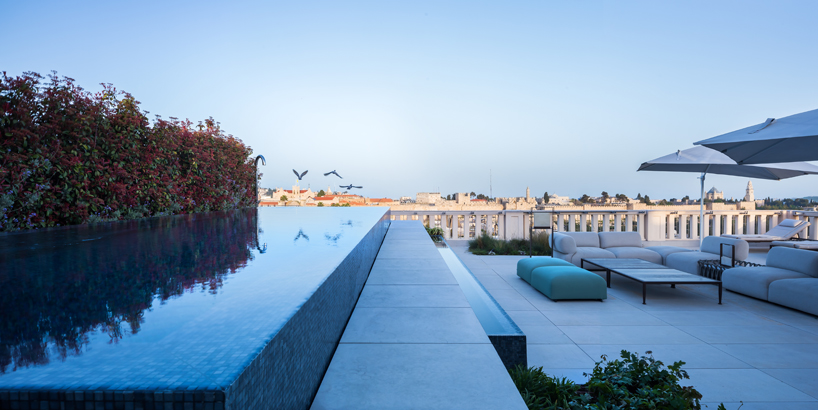 yoma architects clads luxury penthouse in marble and brass detailing in jerusalem