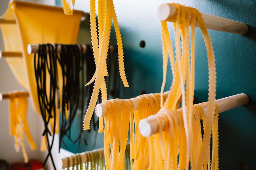 siren betty design suspends a teal blue vespa in chicago's tortello pasta shop designboom