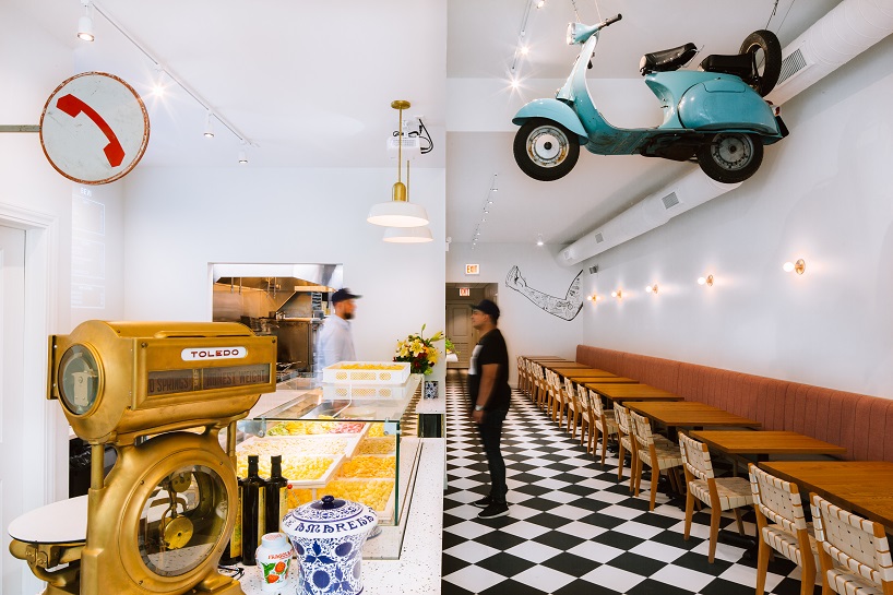 siren betty design suspends a teal blue vespa in chicago's tortello pasta shop designboom